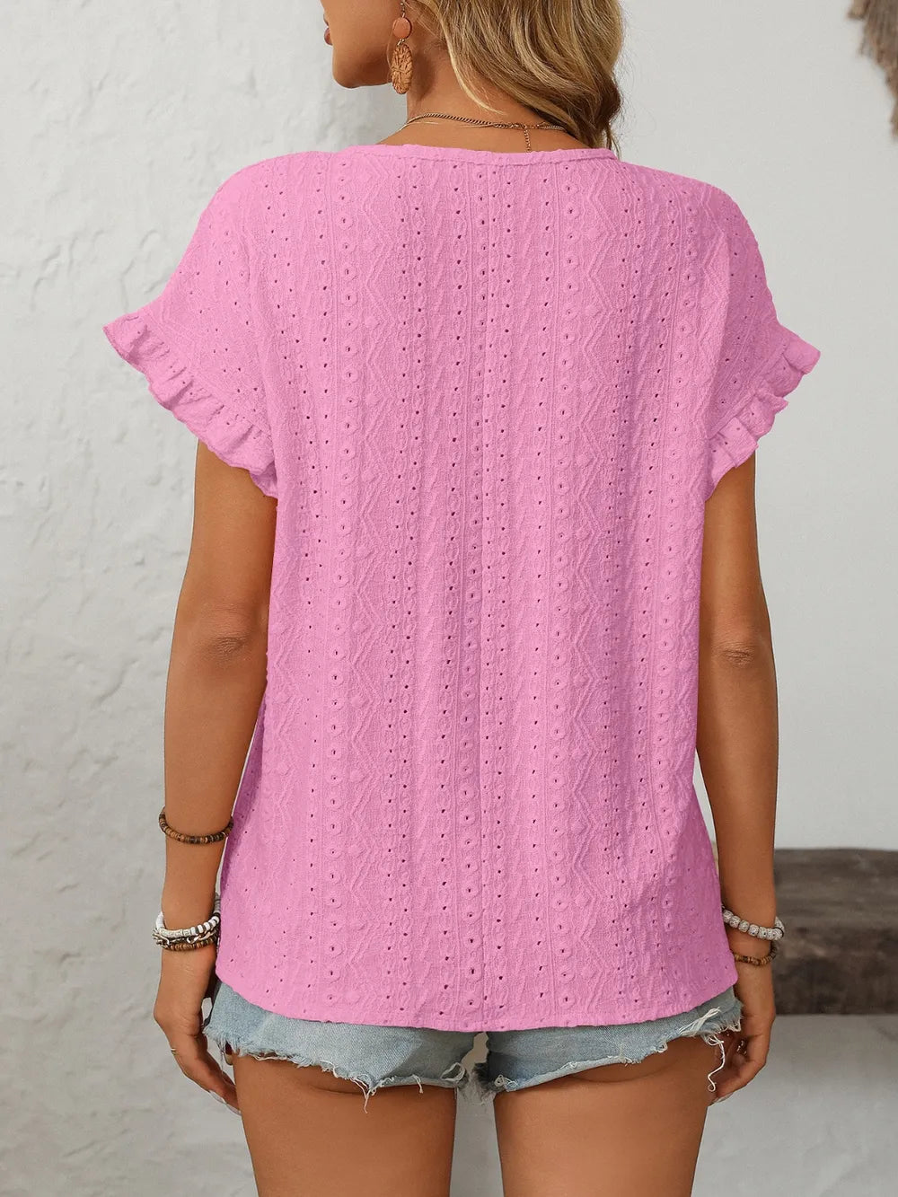 Eyelet short sleeve top fabric close up